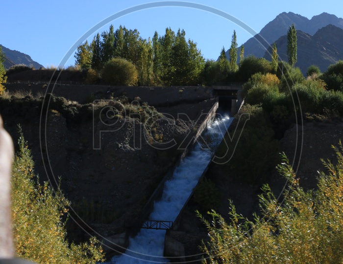 Water flow and Mountains in Background