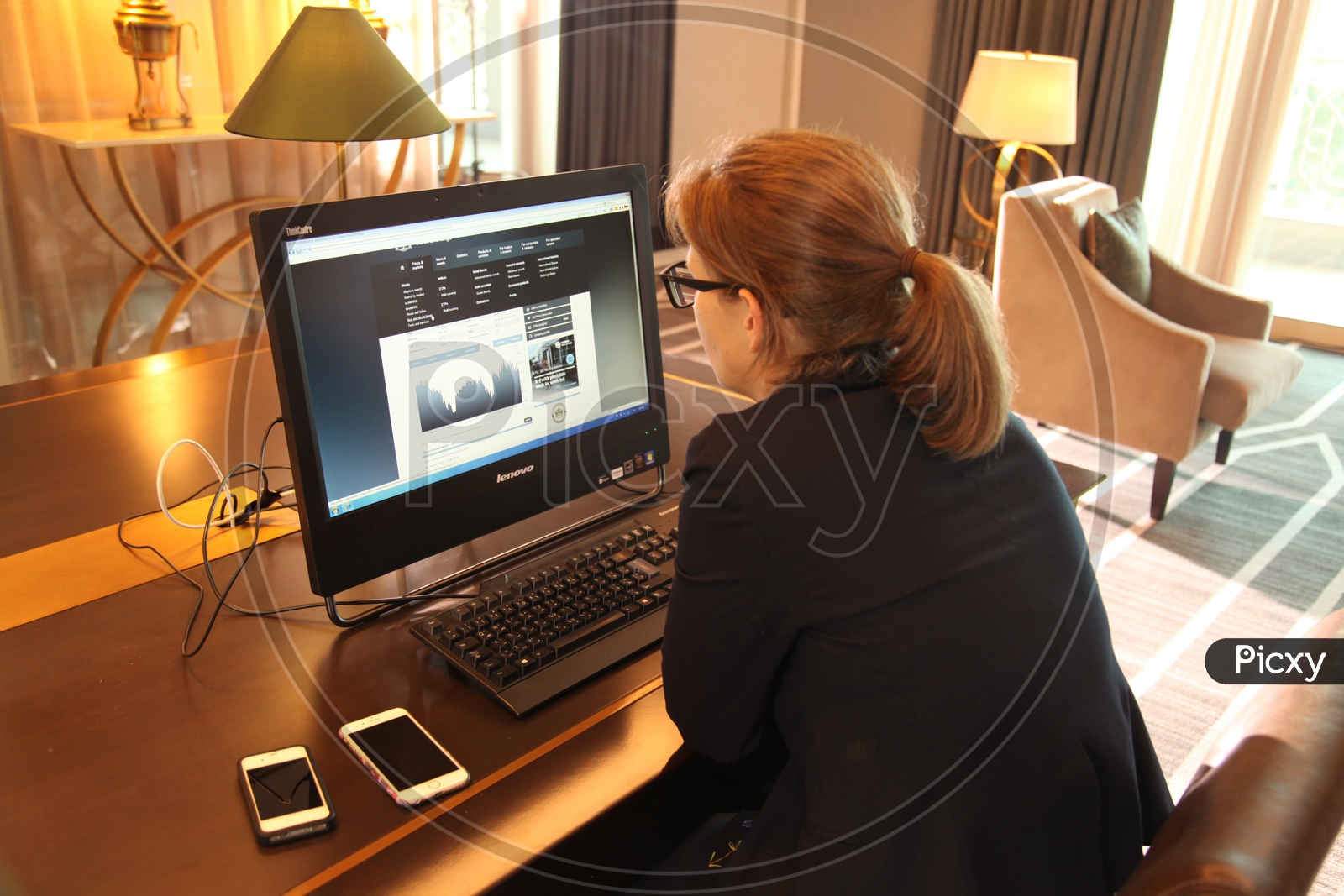 A woman working on a desktop