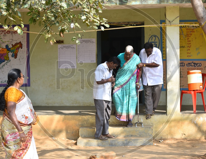 An Old woman Coming Out of a Election Poling Station After Casting Her Vote