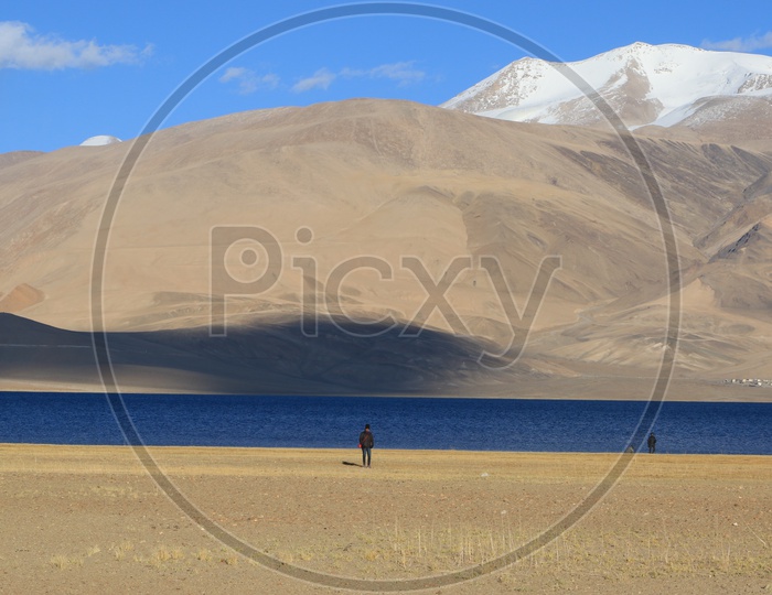 A Tourist at A River Valley With Sand Dunes and Blue Sky in Leh