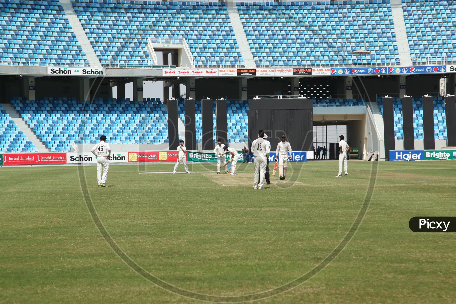 Cricket Match Playing By Players in Sharja Cricket Stadium