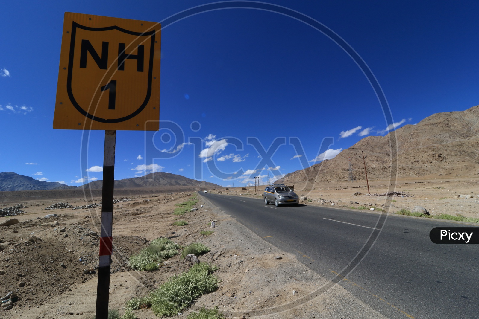 Car traveling on the roadways of leh