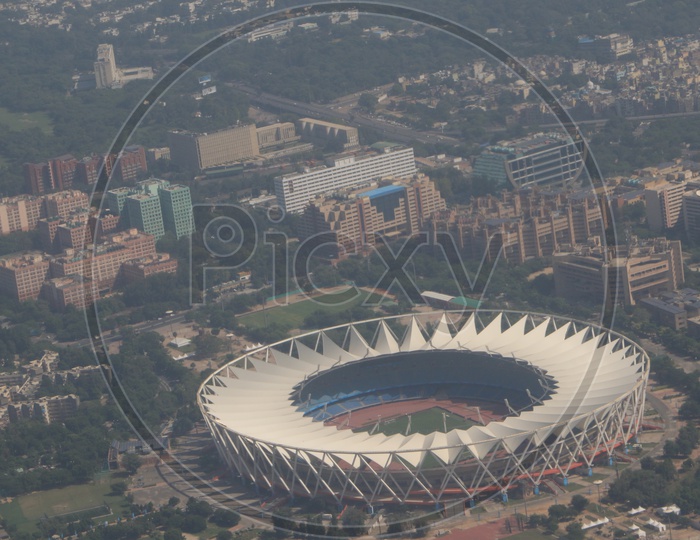 Delhi city in aerial view captured from flight window / Stadium in Delhi