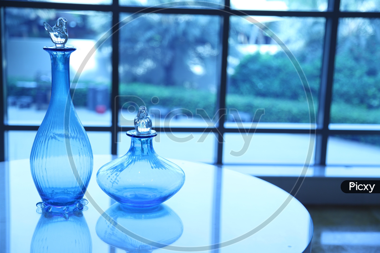 Blue glass vases on a table