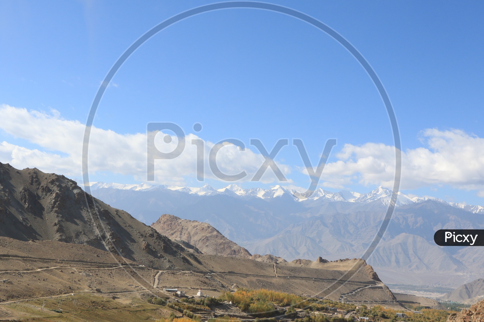 Valley views From The Hill tops In Leh with Snow Capped Mountains