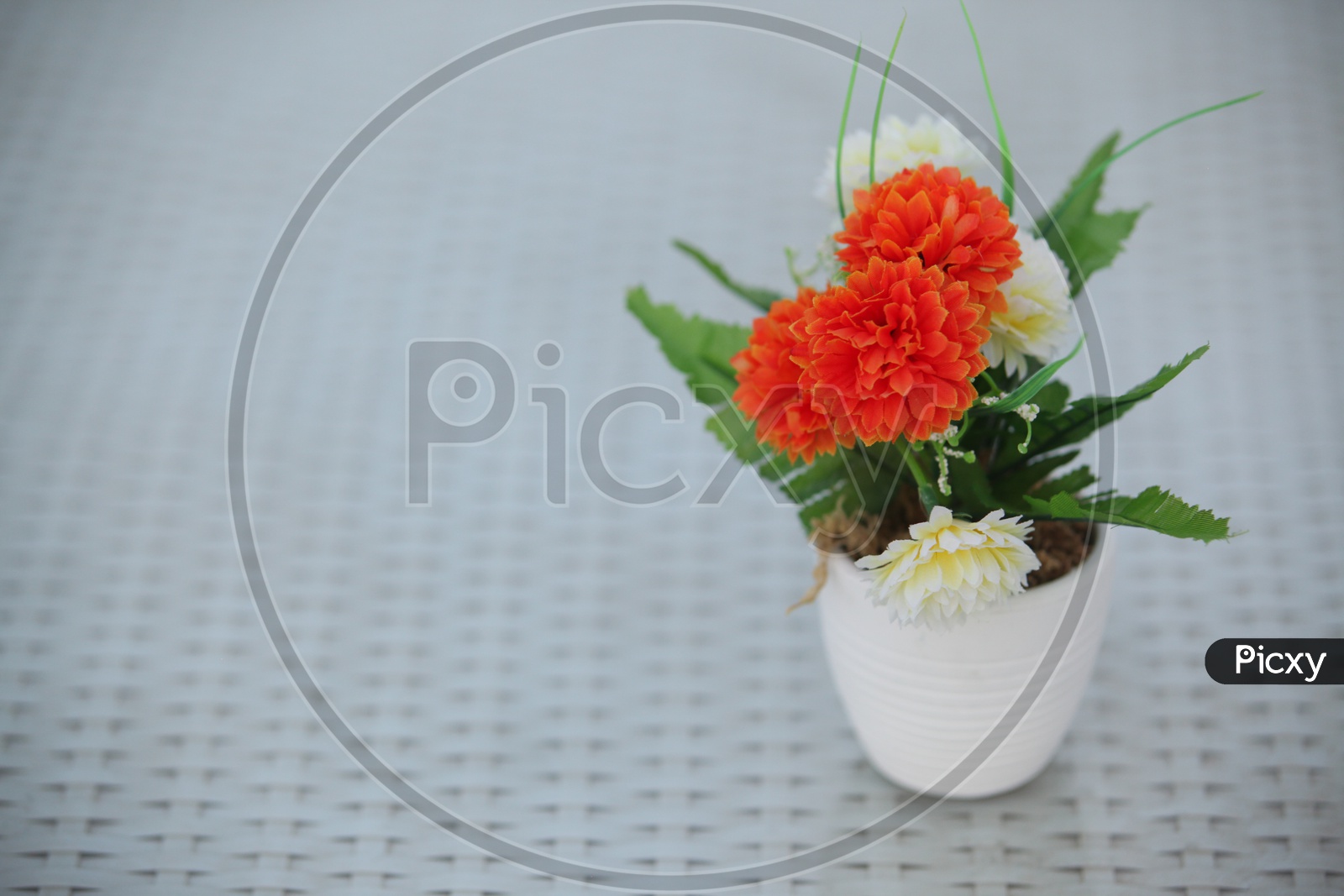 Artificial Flowers in a white pot