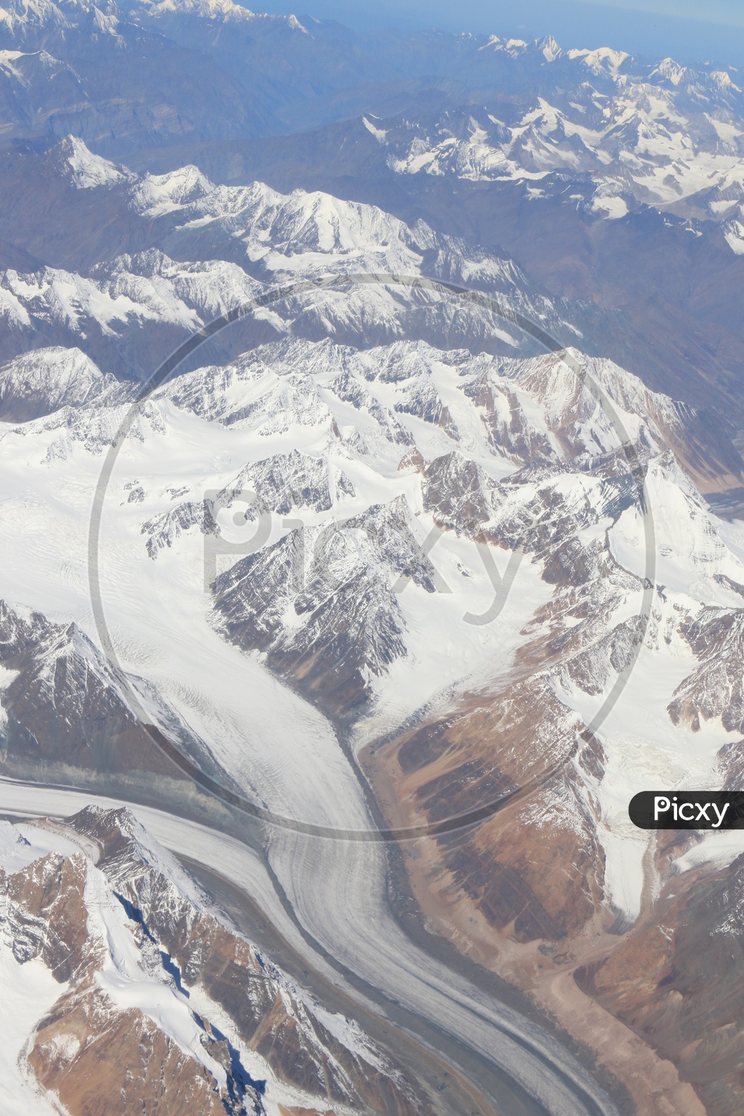 Beautiful snow-capped mountains of leh captured from flight window