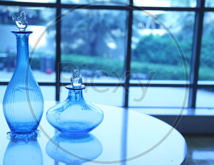 Blue glass vases on a table