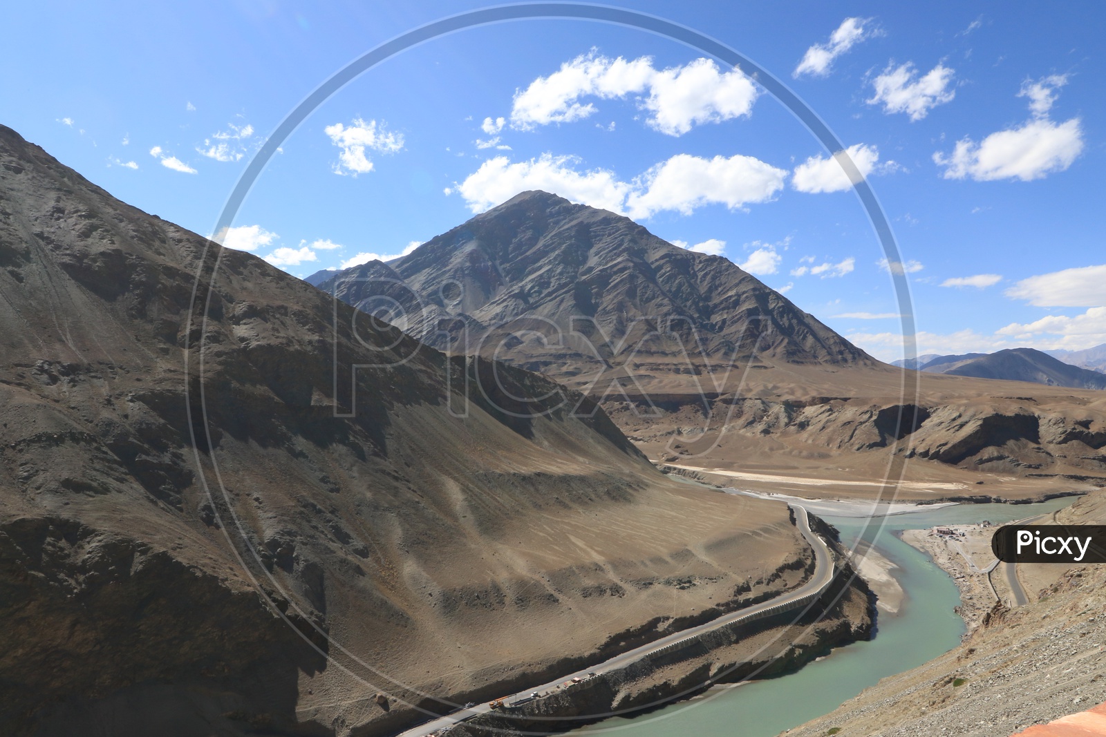 Mountains of leh with water flow in the foreground