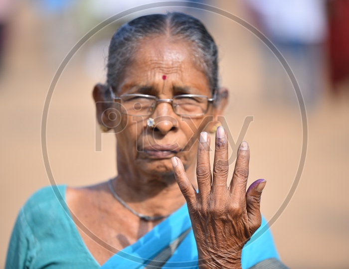 Image Of Indian Old Man Showing His Voted Finger Towards The Camera
