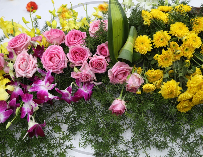 Decor with Pink Roses, Orchids & Yellow flowers