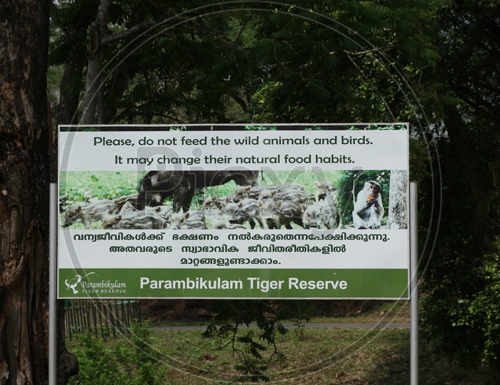 A hoarding indicating 'not to feed wildlife' at Parambikulam Tiger Reserve