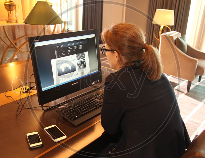 A woman working on a desktop