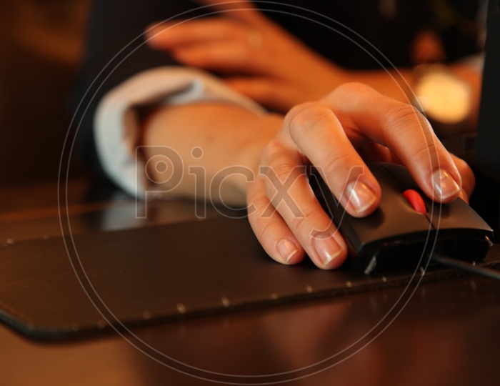 Close up shot of hands using mouse