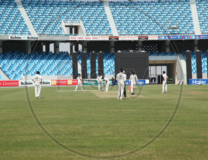 Cricket Match Playing By Players in Sharja Cricket Stadium