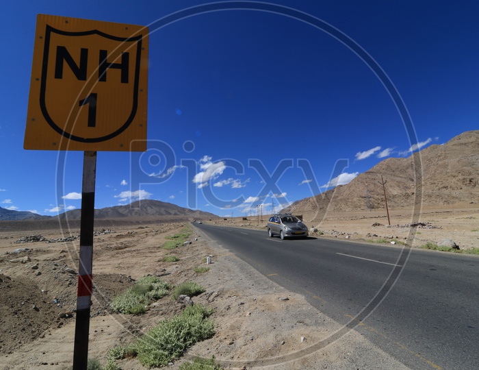 Car traveling on the roadways of leh