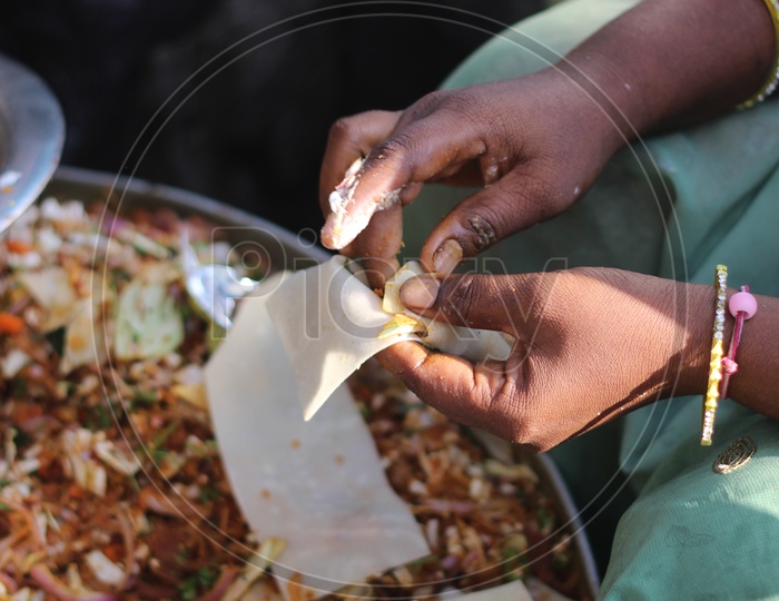 A Woman Preparing The Indian Street Food Samosa
