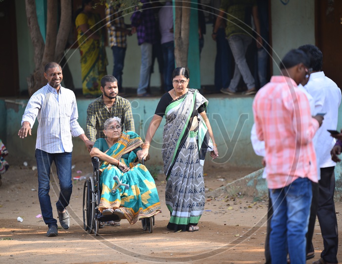 An Old woman Coming to Election Poling Station to Cast Her Vote