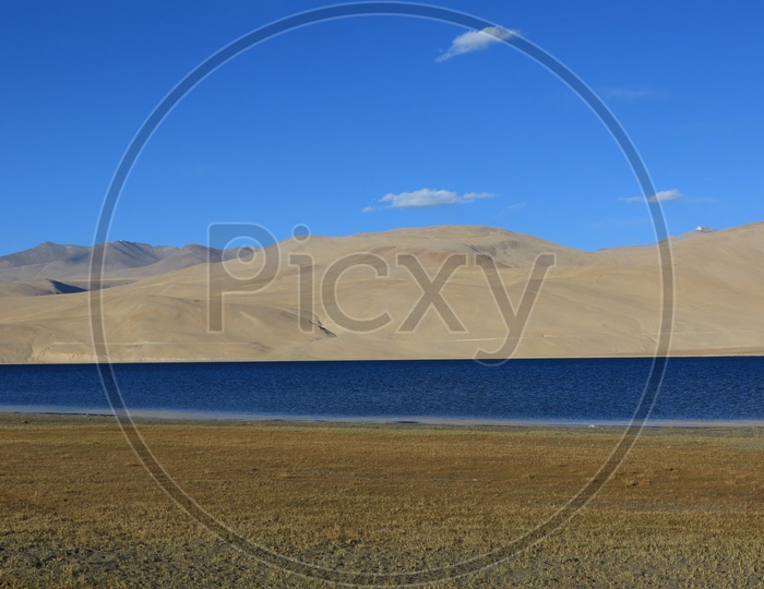 A River Valley With Sand Dunes and Blue Sky