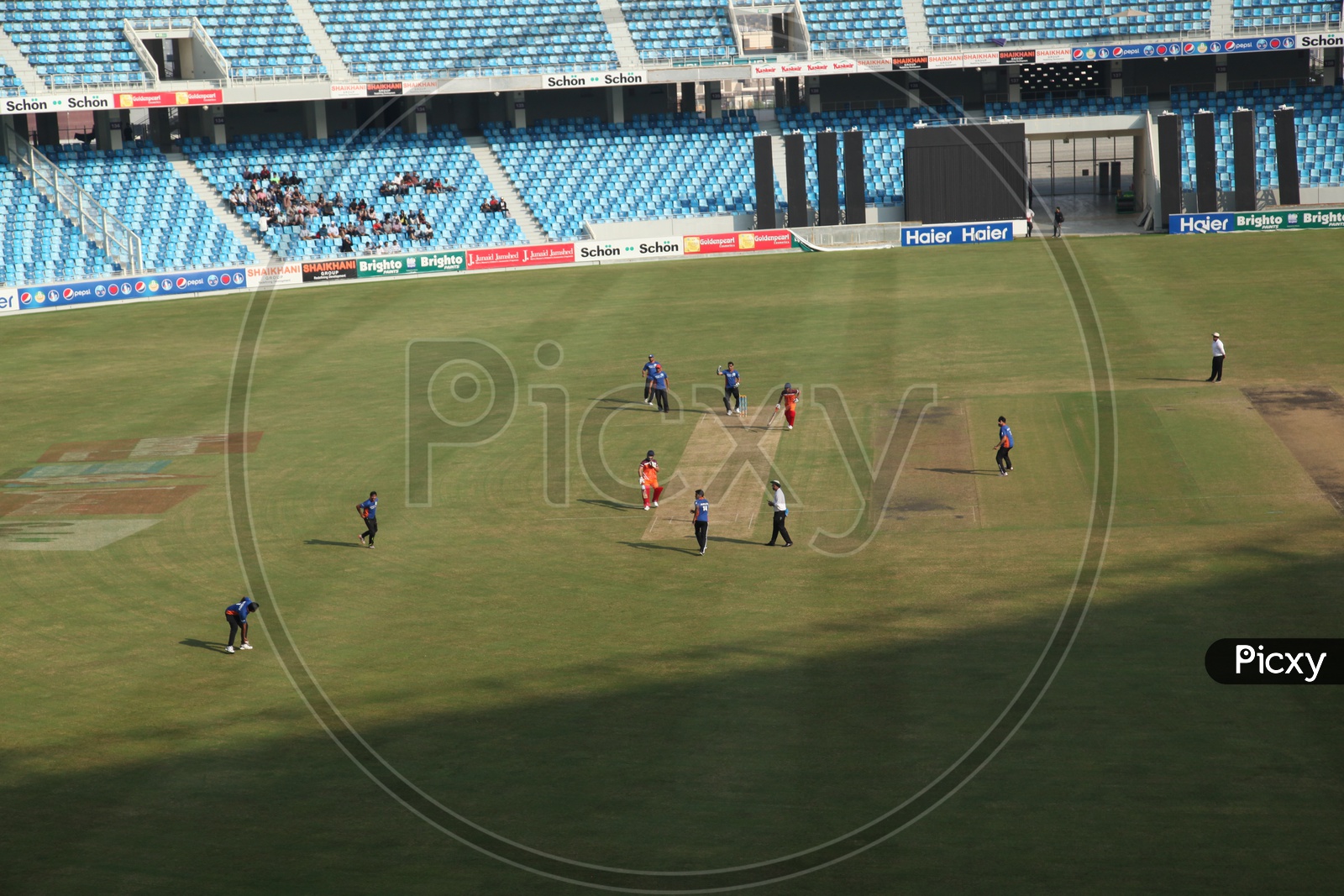 Cricket Match Playing by Players in Sharja Stadium
