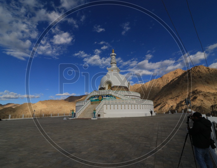 A man photographing Shanti stupa at Leh