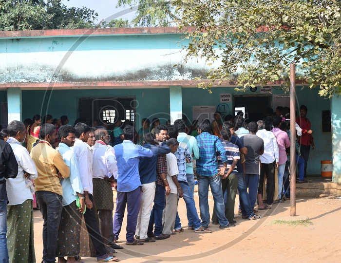 People standing in queue at poll booth to use their vote