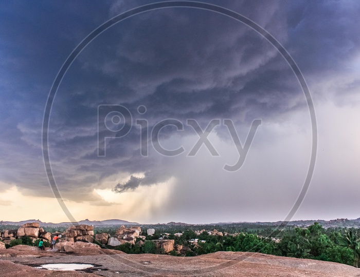 View from top of a hill with dark sky