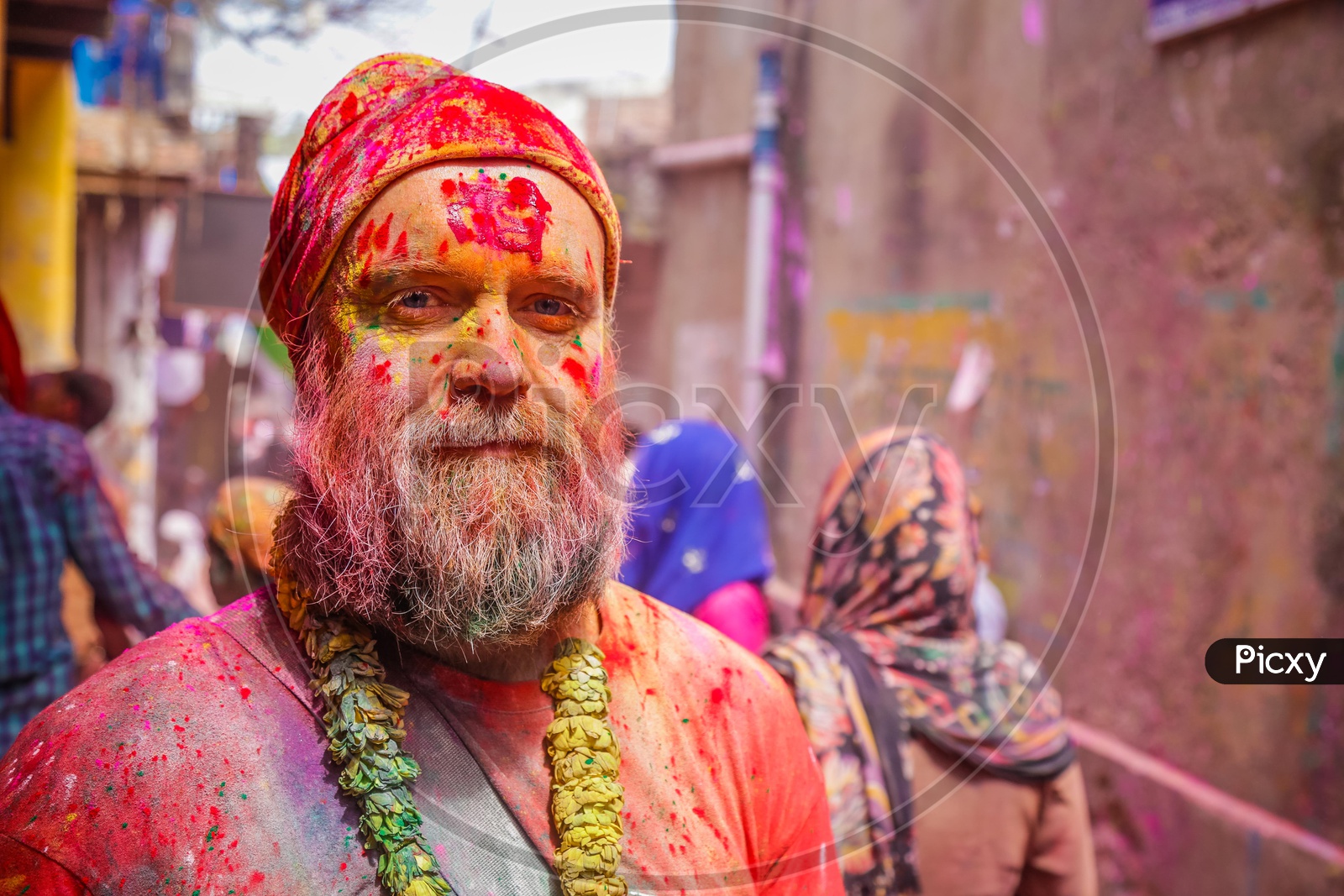 Indian men with coloured face in Barsana