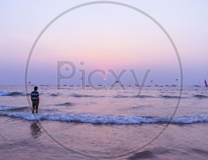 A man in Goa beach during Sunset