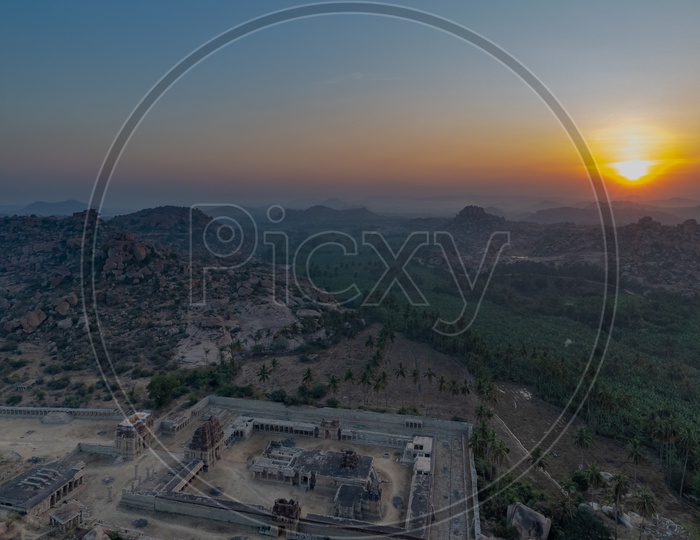 Aerial View of Hampi temple with sunset in the background