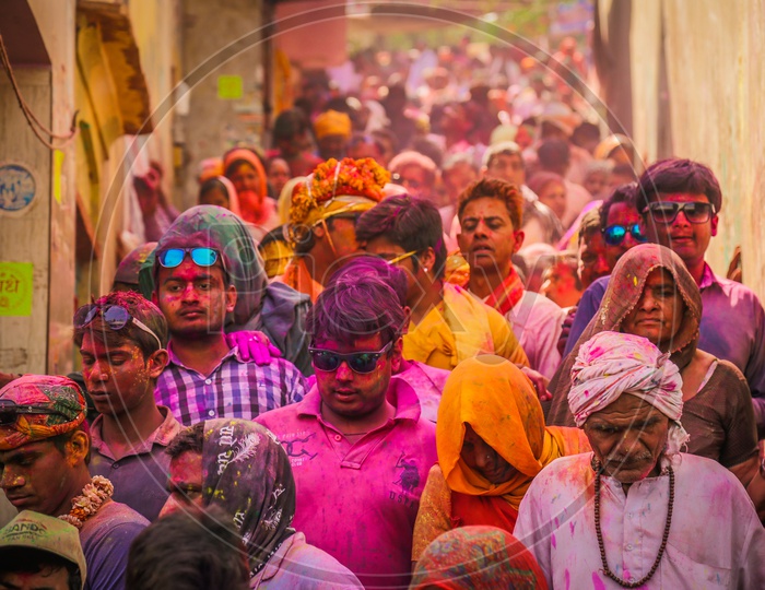 People celebrating Holi in the streets of Barsana