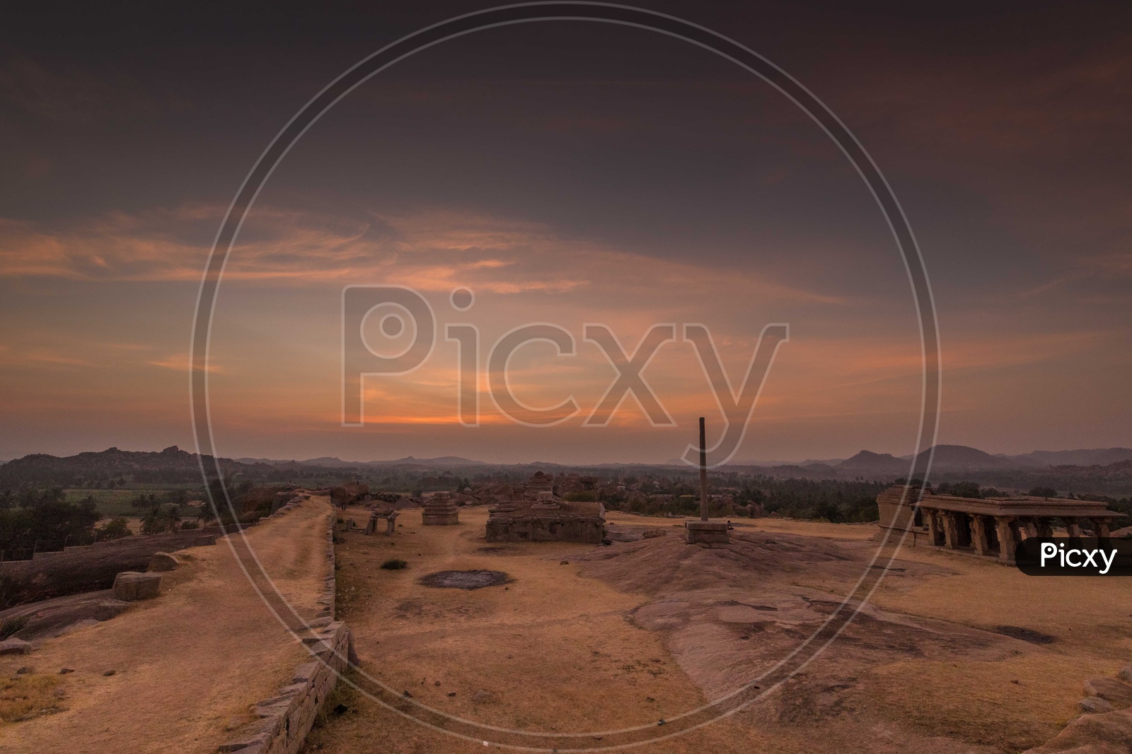Sunset over the temple and hills in Hampi