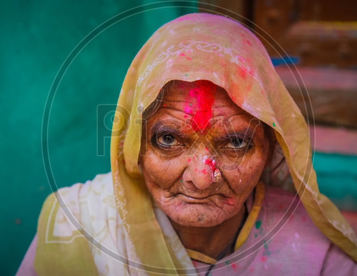 Holi/Indian Festival - Woman with colors/colours on face