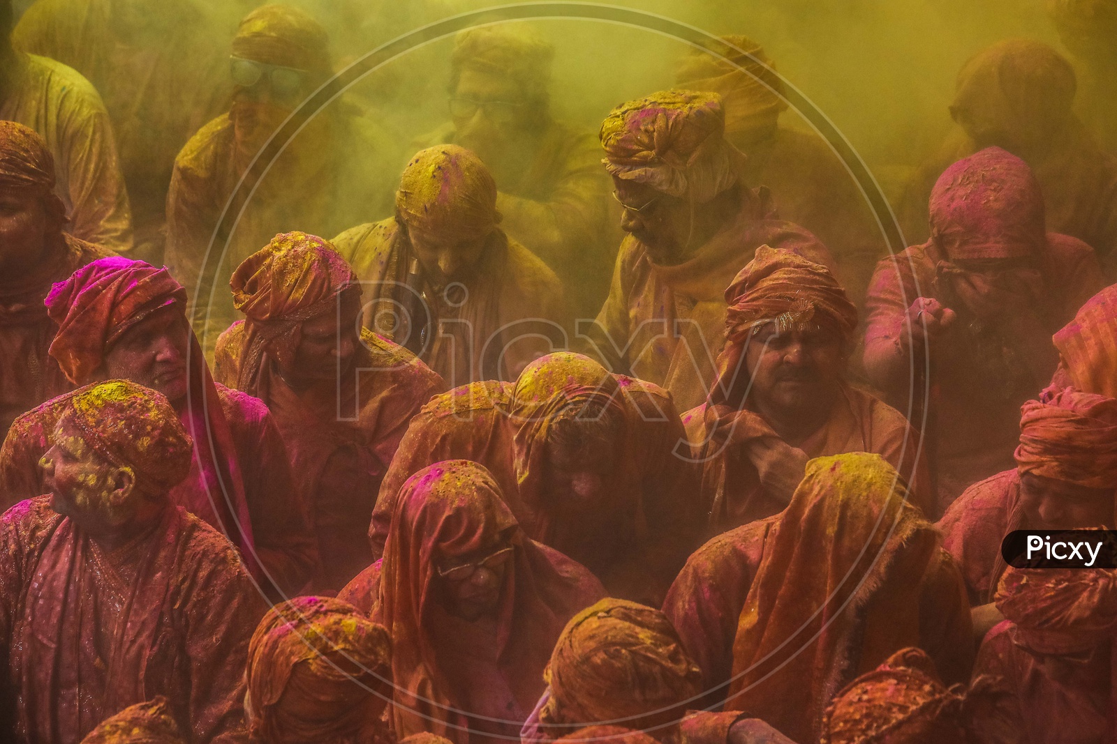 People celebrate the traditional and a ritualistic Holi at Radharani temple