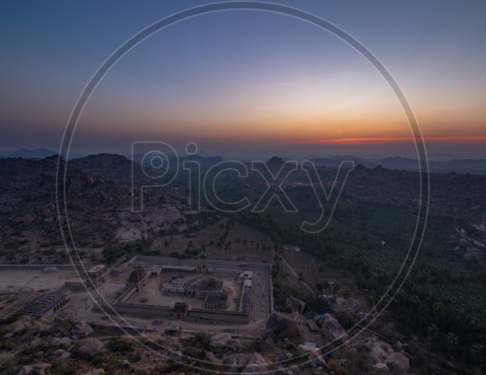 Beautiful sunset view in Hampi with temple in the foreground