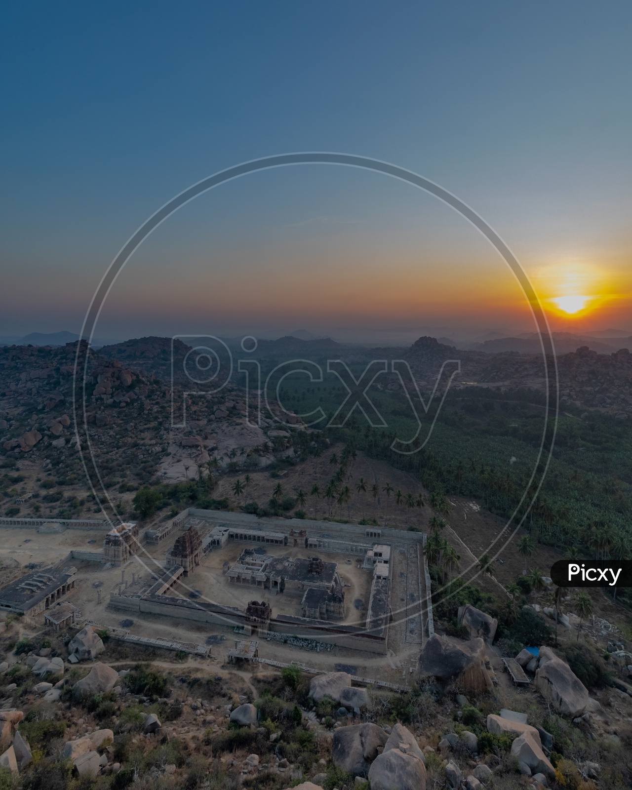 Aerial View of Hampi temple with sunset in the background