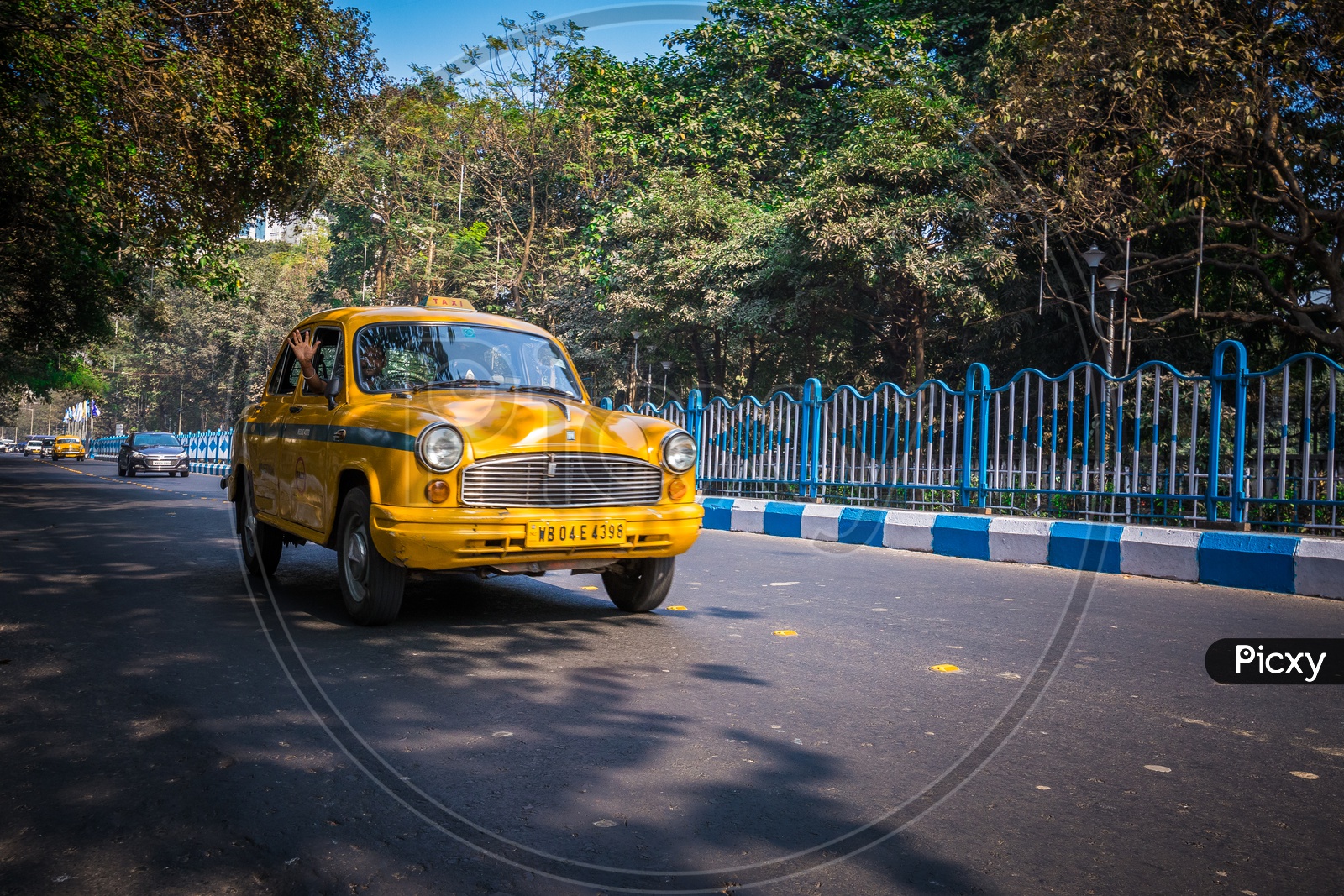 Yellow Taxi moving on the roads of Kolkata