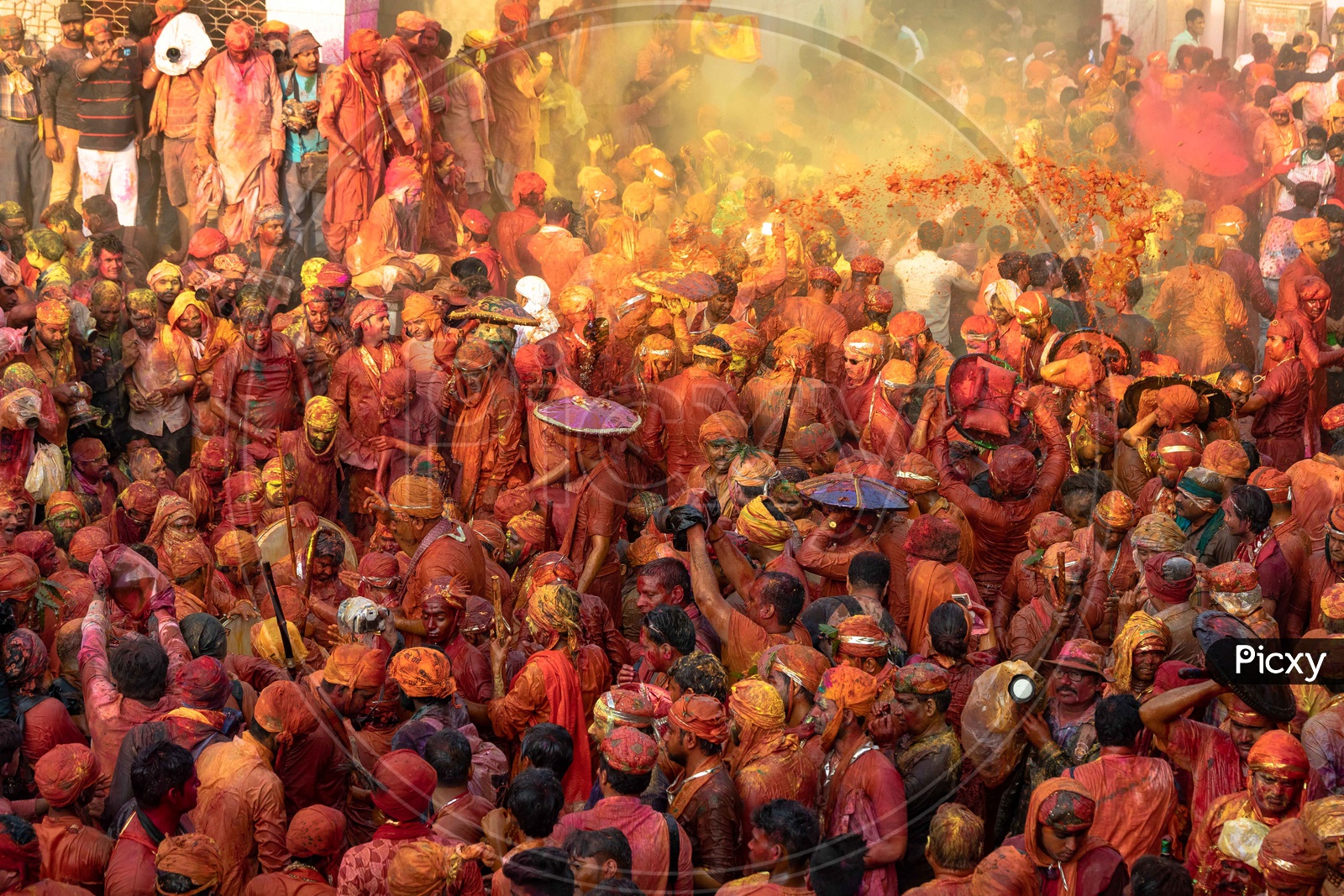 People celebrating  Holi in Radharani temple at Barsana