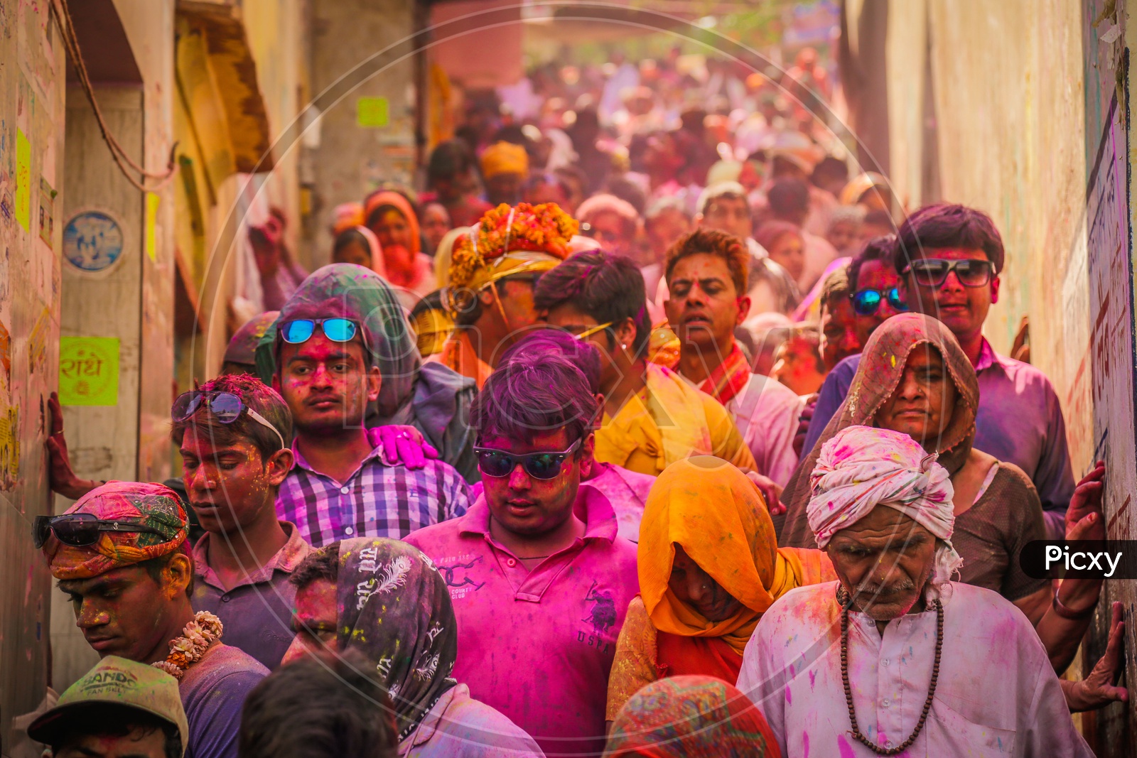 People celebrating Holi in the streets of Barsana