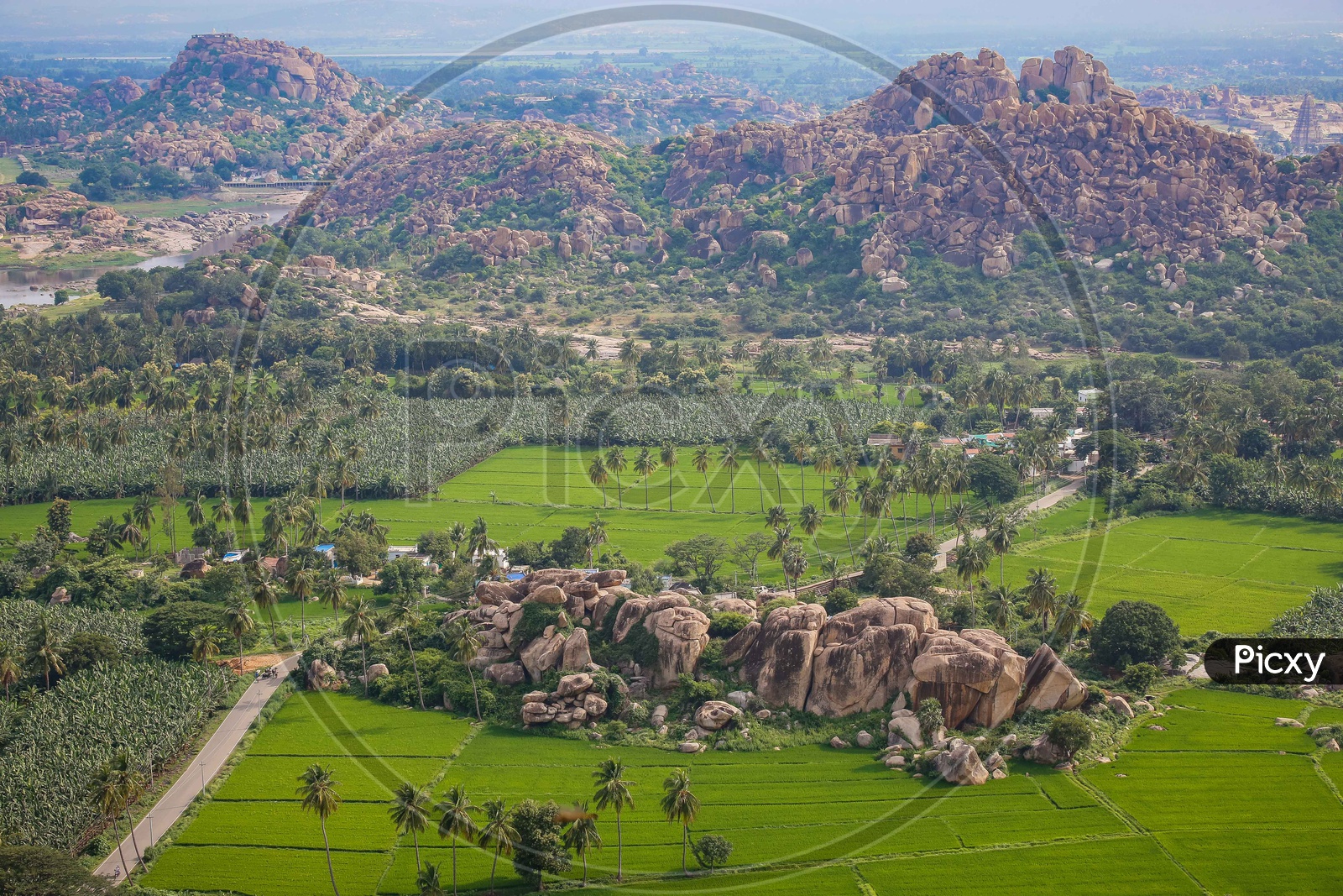 Beautiful view of Agriculture fields and mountains of Hampi in Aerial View