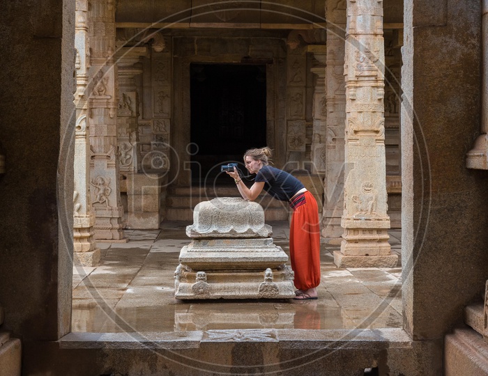 Foreign Photographer taking Pictures of Hampi Temple