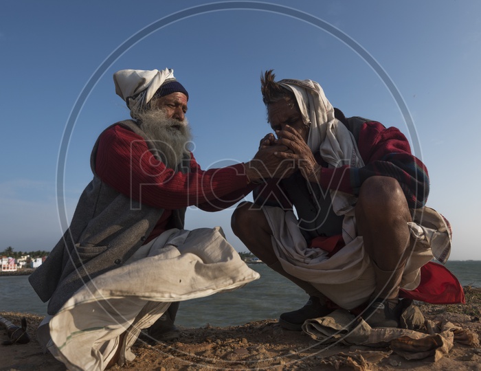Two old men at the sea shore