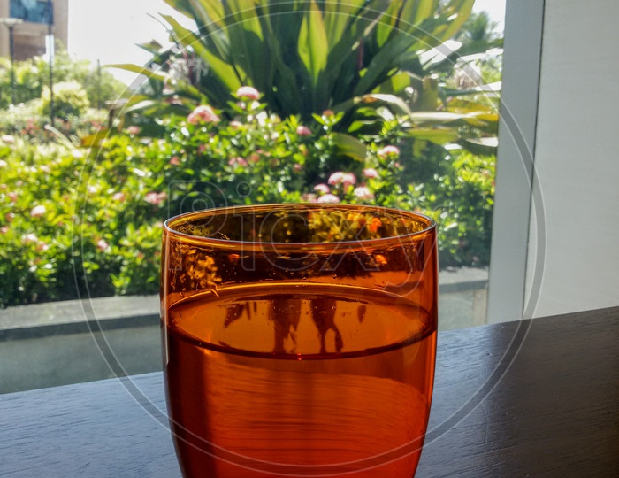 Orange glass filled with water