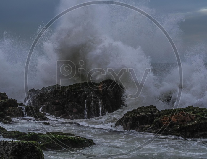 Water waves hitting the rock at Vizag beach