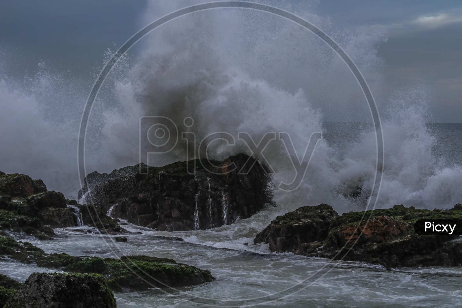 Water waves hitting the rock at Vizag beach