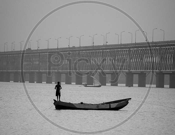 Man standing on a boat at Rajahmundry