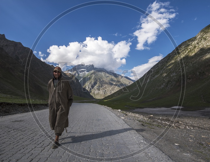 Kashmiri Man walking on Road