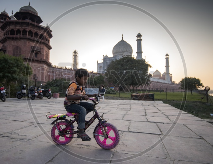 Kid Cycling near Taj Mahal