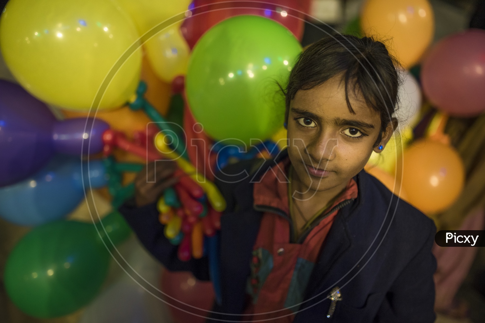 Girl Selling Balloons in the Streets