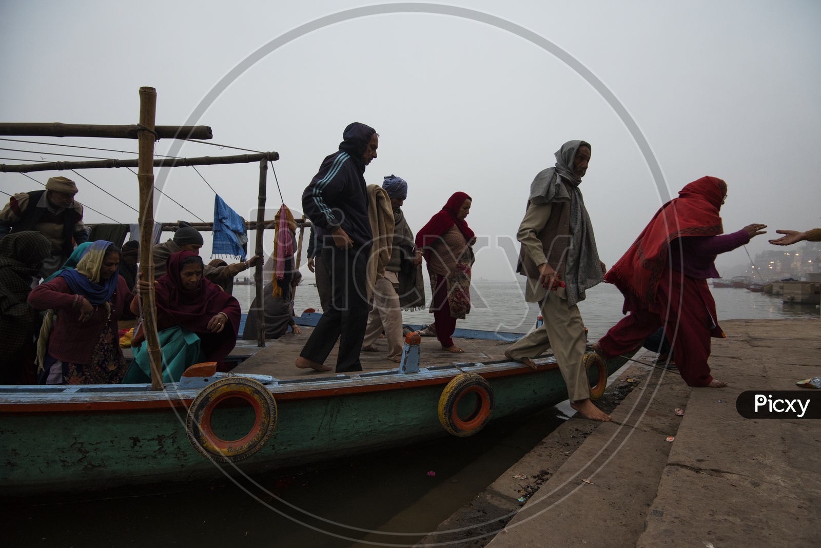 Devotees getting down from a Boat in Varanasi